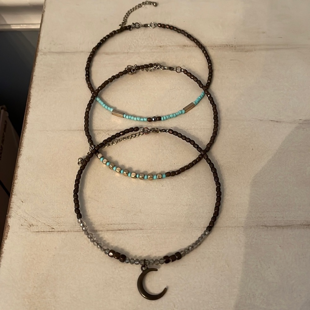 3 choker style necklaces.